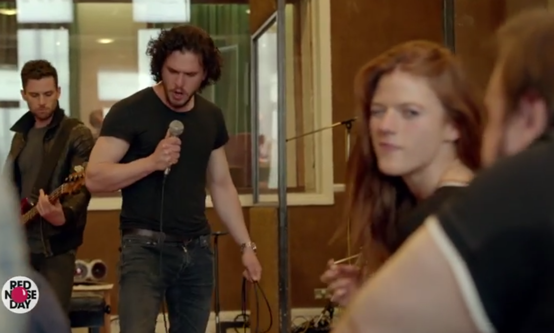 Kit Harrington (Jon Snow) performs "Wildling" to a delighted Leslie Rose (Ygritte) Image source: Screen grab / YouTube